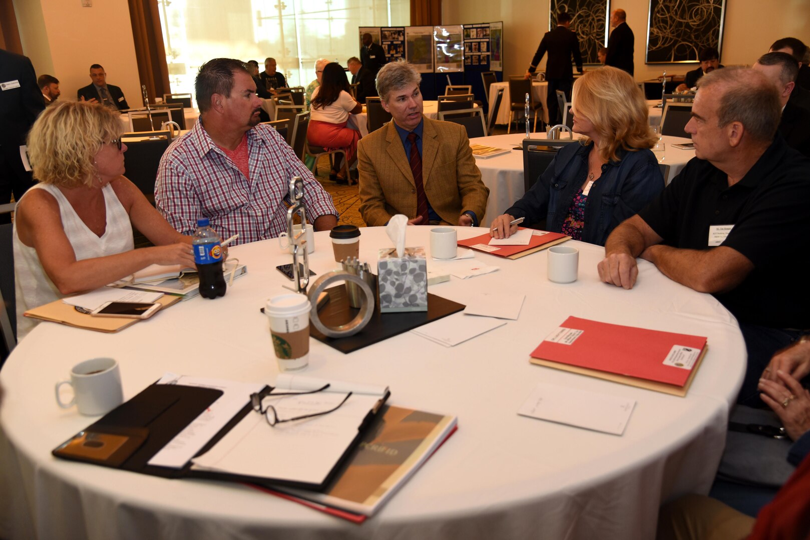 Dr. John Byrd, Defense POW/MIA Accounting Agency laboratory director, answers a question presented by Kristine Momper and Shari Mulvey, nieces of Army Sgt. Donald Dean Noehren, Aug. 12, 2016, at the Korean/Cold War Annual government briefings in Arlington, Virginia. Noehren was one of the Korean War veterans that was identified by DNA. 
