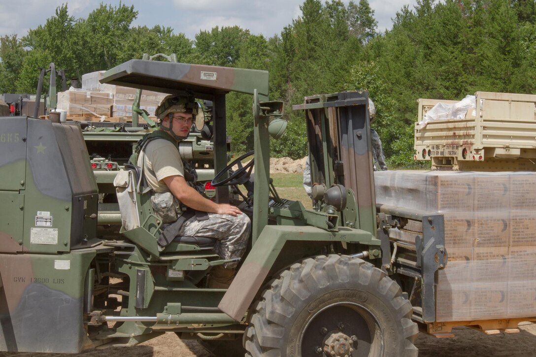 U.S. Army Spc. Nickolas Zey, 397th Forward Support Company, Eau Claire, WI, loads ration crates with a forklift during Combat Support Training Exercise (CSTX) 86-16-03 at Fort McCoy, Wis., August 10, 2016. The 84th Training Command’s third and final Combat Support Training Exercise of the year hosted by the 86th Training Division at Fort McCoy, Wis. is a multi-component and joint endeavor aligned with other reserve component exercises. (U.S. Army photo by Spc. Garrett Johnson/Released)