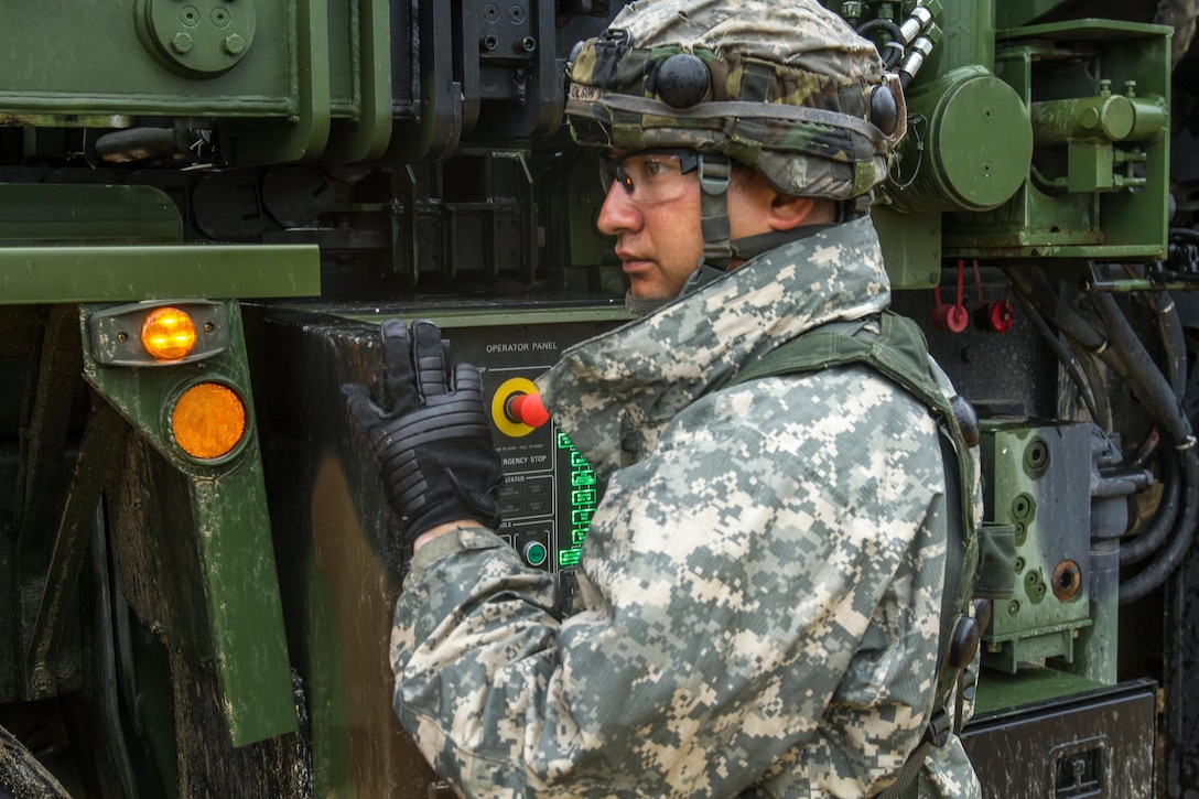 U.S. Army Sgt. Harold Olson, 652nd Engineer Company, Hammond, WI, adjusts the operator control panel while unloading an A-Frame for a Dry Support Bridge Launcher as part of Combat Support Training Exercise (CSTX) 86-16-03 at Fort McCoy, Wis., August 11, 2016. The 84th Training Command’s third and final Combat Support Training Exercise of the year hosted by the 86th Training Division at Fort McCoy, Wis. is a multi-component and joint endeavor aligned with other reserve component exercises. (U.S. Army photo by Spc. Garrett Johnson/Released)