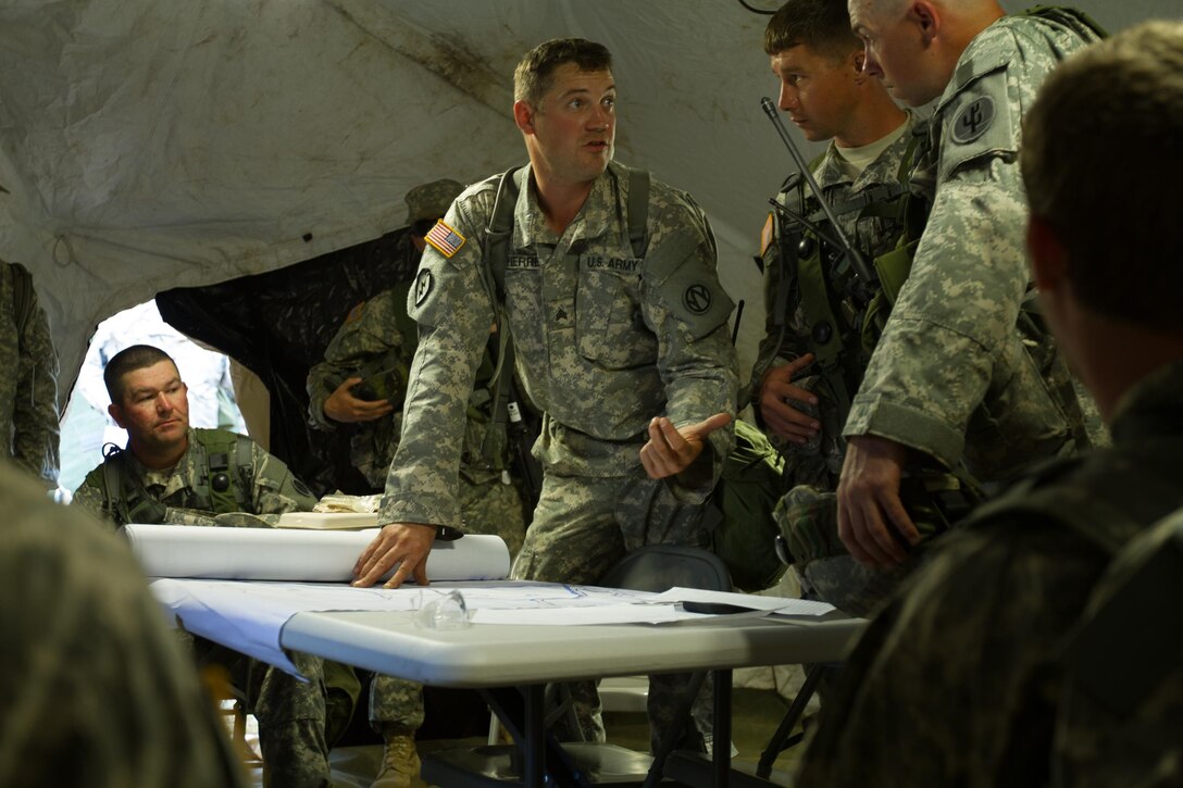 U.S. Army Sgt. Stephen Lapierre, 245th Maintenance Company, Washington, MO, discusses the rules of engagement for a perimeter patrol during Combat Support Training Exercise (CSTX) 86-16-03 at Fort McCoy, Wis., August 9, 2016. The 84th Training Command’s third and final Combat Support Training Exercise of the year hosted by the 86th Training Division at Fort McCoy, Wis. is a multi-component and joint endeavor aligned with other reserve component exercises. (U.S. Army photo by Spc. Garrett Johnson/Released)