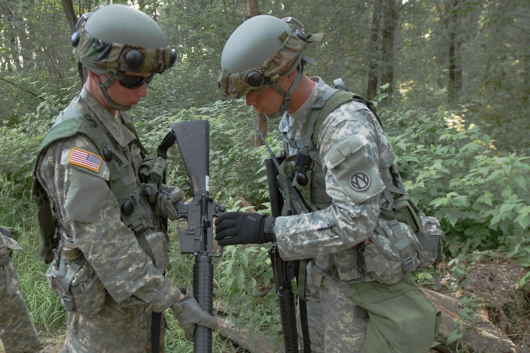 U.S. Army Soldiers from the 245th Maintenance Company, Washington, MO, inspect equipment after a perimeter patrol during Combat Support Training Exercise (CSTX) 86-16-03 at Fort McCoy, Wis., August 9, 2016. The 84th Training Command’s third and final Combat Support Training Exercise of the year hosted by the 86th Training Division at Fort McCoy, Wis. is a multi-component and joint endeavor aligned with other reserve component exercises. (U.S. Army photo by Spc. Garrett Johnson/Released)