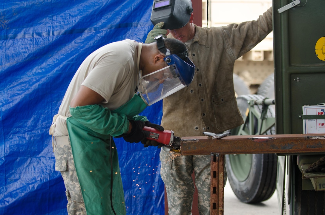 U.S. Army Reserve Spc. Dantoine Ballard, from the 245th Engineer Company, St. Charles, Mo., uses a disc grinder to prepare metal for fabrication during Combat Support Training Exercise (CSTX) 86-16-03 at Fort McCoy, Wis., August 12, 2016. The 84th Training Command’s third and final Combat Support Training Exercise of the year hosted by the 86th Training Division at Fort McCoy, Wis. is a multi-component and joint endeavor aligned with other reserve component exercises. (U.S. Army photo by Spc. Cody Hein/Released)