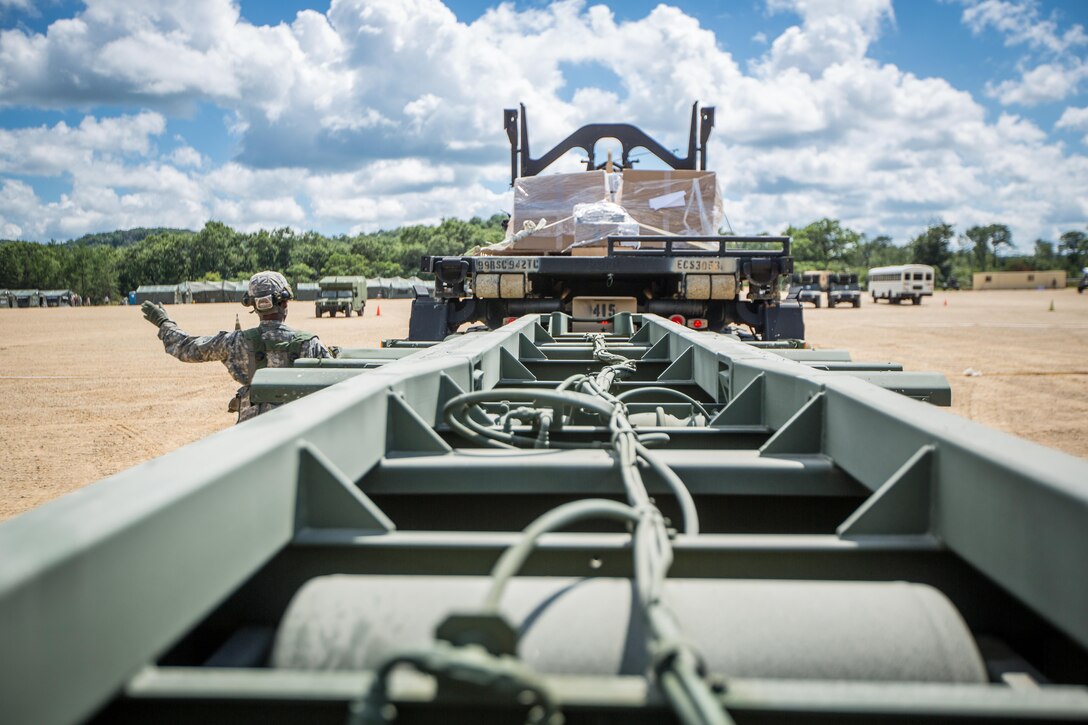 U.S. Army Reserve Pfc. Davon Walker, 942nd Transportation Company, 395th Combat Support Sustainment Brigade, West Hartford, Conn., guides an M1075 Palletized Load System during a Combat Support Training Exercise at Fort McCoy, Wis., August 13, 2016. The 84th Training Command’s third and final Combat Support Training Exercise of the year hosted by the 86th Training Division at Fort McCoy, Wis. is a multi-component and joint endeavor aligned with other reserve component exercises. (U.S. Army photo by Spc. John Russell/Released)