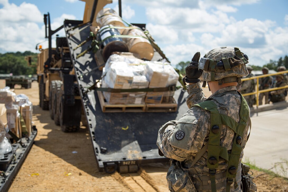 U.S. Army Reserve Sgt. Noel Rodriguez, 942nd Transportation Company, 395th Combat Support Sustainment Brigade, West Hartford, Conn., guides an M1075 Palletized Load System during a Combat Support Training Exercise at Fort McCoy, Wis., August 13, 2016. The 84th Training Command’s third and final Combat Support Training Exercise of the year hosted by the 86th Training Division at Fort McCoy, Wis. is a multi-component and joint endeavor aligned with other reserve component exercises. (U.S. Army photo by Sgt. Robert Farrell/Released)