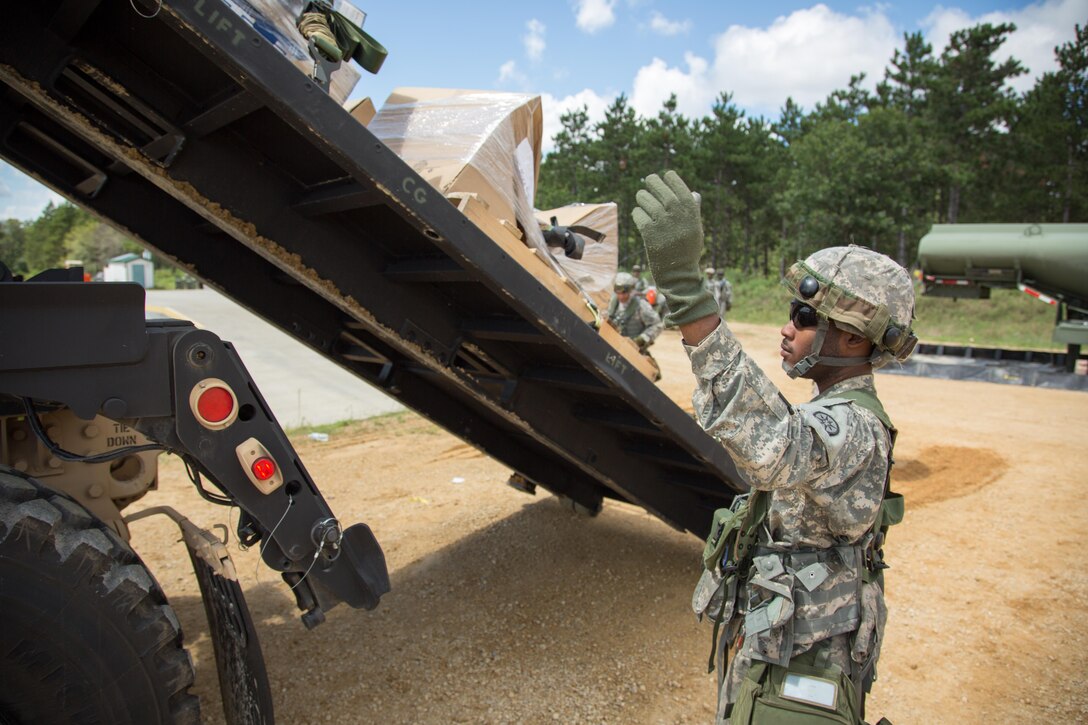 U.S. Army Reserve Pfc. Davon Walker, 942nd Transportation Company, 395th Combat Support Sustainment Brigade, West Hartford, Conn., guides an M1075 Palletized Load System during a Combat Support Training Exercise at Fort McCoy, Wis., August 13, 2016. The 84th Training Command’s third and final Combat Support Training Exercise of the year hosted by the 86th Training Division at Fort McCoy, Wis. is a multi-component and joint endeavor aligned with other reserve component exercises. (U.S. Army photo by Sgt. Robert Farrell/Released)