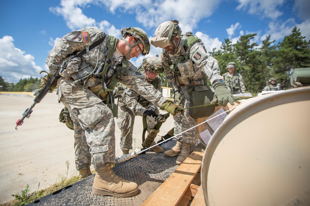 U.S. Army Soldiers from the 533rd Bridging Support Battalion, Queens, N.Y., and the 942nd Transportation Company, West Hartford, Conn., secure a pallet to be transported via M1075 Palletized Load System during Combat Support Training Exercise (CSTX) 86-16-03 at Fort McCoy, Wis., August 13, 2016. The 84th Training Command’s third and final Combat Support Training Exercise of the year hosted by the 86th Training Division at Fort McCoy, Wis. is a multi-component and joint endeavor aligned with other reserve component exercises. (U.S. Army photo by Spc John Russell/Released)