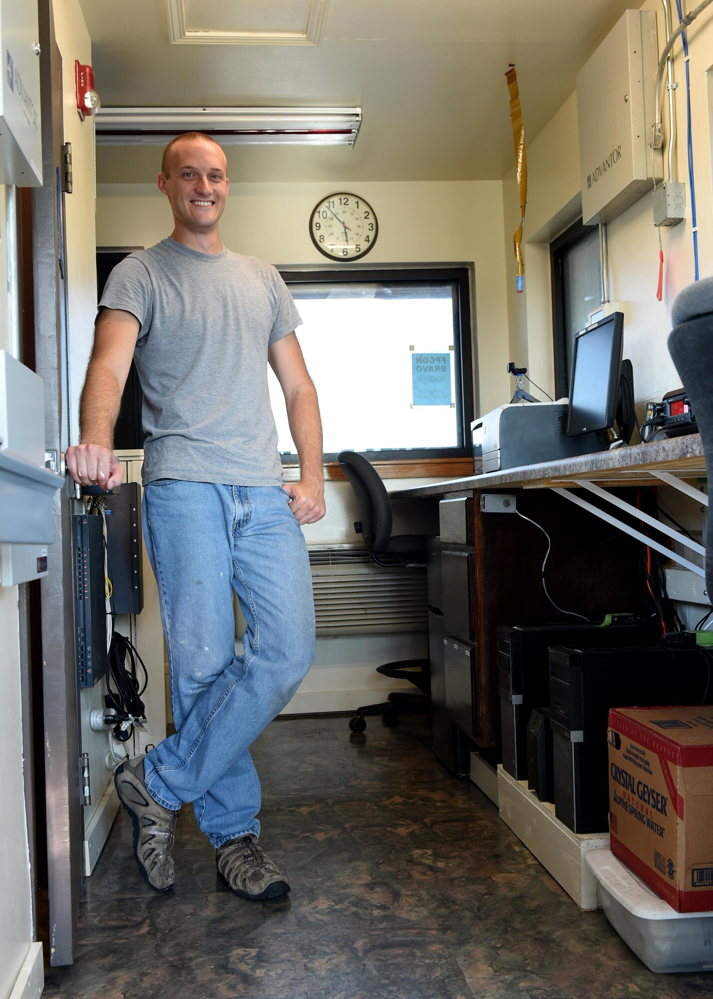 U.S. Air Force Airman 1st Class Jason Martin, 97th Security Forces Squadron response force member, stands inside the completed entry facility that he and other 97th SFS Airmen remodeled, August 1, 2016, at Altus Air Force Base Okla. 97th SFS Airmen, led by Martin, took the initiative to remodel the main gate entry facility to improve efficiency and aesthetics. (U.S. Air Force photo by Airman 1st Class Kirby Turbak/Released)