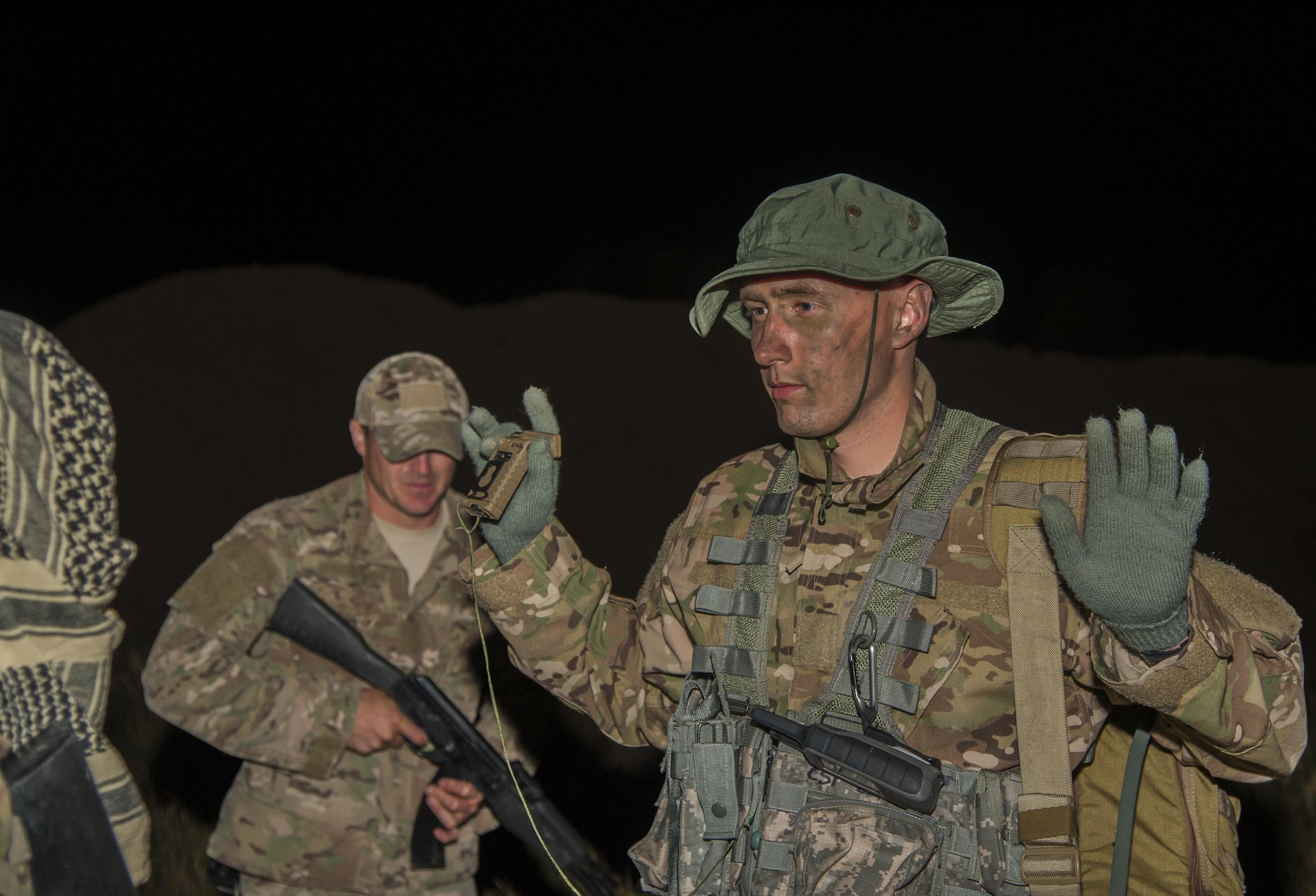 A Minot Airman listens to instructions during an evasion exercise at Garrison, N.D., Aug. 11, 2016. Different squadrons from Minot Air Force Base train with survive, evasion, resistance and escape specialists regularly to maintain readiness in the event of an emergency. (U.S. Air Force photo/Airman 1st Class Christian Sullivan)