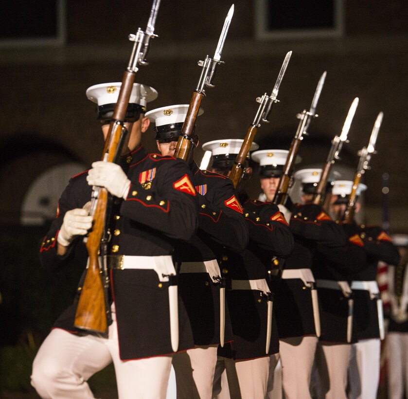 The United States Marine Corps Silent Drill Platoon performs during the Evening Parade at Marine Barracks, Washington, D.C., Aug. 12, 2016. The guests of honor for the parade were Vice Adm. John Aquilino, deputy chief of Naval Operations, Plans and Strategies, Rear Adm. Linda Fagan, deputy commandant for Operations, Policy and Capabilities, Lt. Gen. William Mayville Jr., director of the Joint Staff, Lt. Gen. Joseph Anderson, joint staff deputy Chief of Staff, Lt. Gen John Raymond, deputy chief of Staff and Operations, and Maj. Gen James Witham, director of Domestic Operations and Force Development. The hosting official for the parade was Lt. Gen. Ronald Bailey, deputy commandant for Plans, Policies and Operations. (Official Marine Corps photo by Lance Cpl. Robert Knapp/Released)