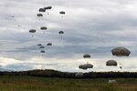 U.S. Army paratroopers perform an airborne insertion from two C-130 Hercules during Red Flag-Alaska at Joint Base Elmendorf-Richardson, Alaska, Aug 10, 2016. Exercises such as this are one of the many ways C-130 crews get to prepare themselves for real-world contingencies. 