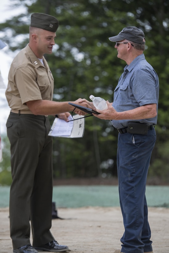 Capt. Brandon Bolhous, the officer in charge with 6th Engineer Support Battalion, 4th Marine Logistics Group, Marine Forces Reserve, thanks Roger Mosley, director of the Standish Public Works Department, for all of their help, guidance, and dedication given to the Marines over the course of the Innovative Readiness Training exercise during the John H. Rich Jr. and Doris Lee Rich Memorial Beach and Ice Fishing Access Facility Dedication Ceremony in Standish, Maine, August 12, 2016. The Marines worked closely with the community to allow access to the beach and complete their annual Innovative Readiness Training. (U.S. Marine Corps photo by Sgt. Sara Graham) 