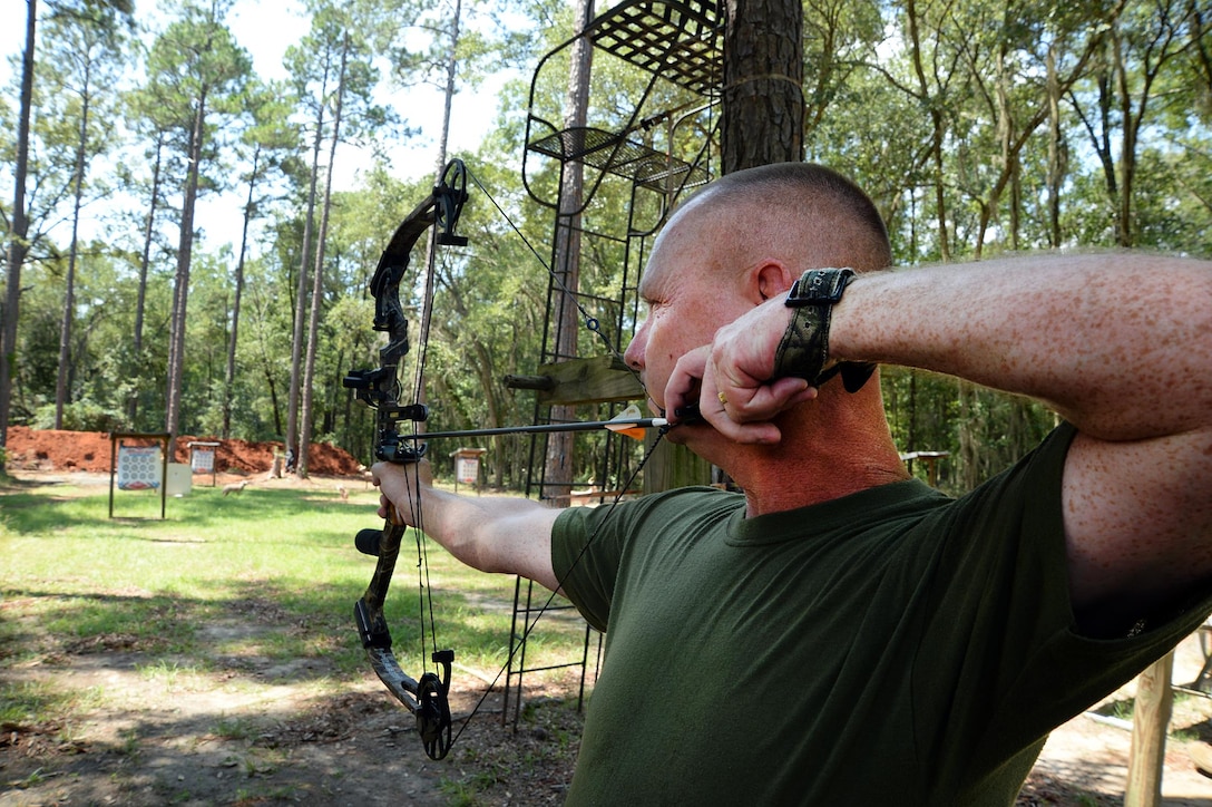Staff Sgt. John R. Harris Jr., training chief, Headquarters Company East, Marine Corps Logistics Command, sights in his bow during a practice at Marine Corps Logistics Albany’s Bow Range, Aug. 4.