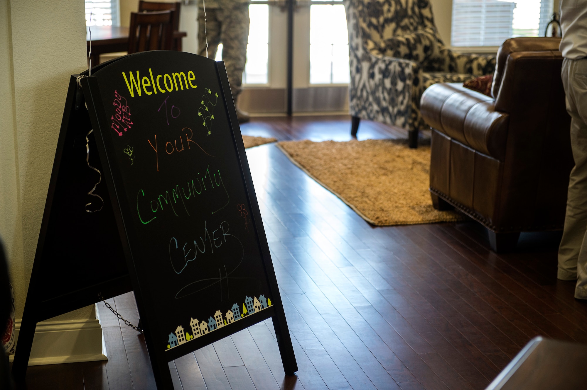 A welcome sign sits during the grand opening of the community center in Azalea Commons, Aug. 12, 2016, in Valdosta, Ga. The community center houses a fitness center, child play area and a pool. (U.S. Air Force photo by Airman 1st Class Janiqua P. Robinson)