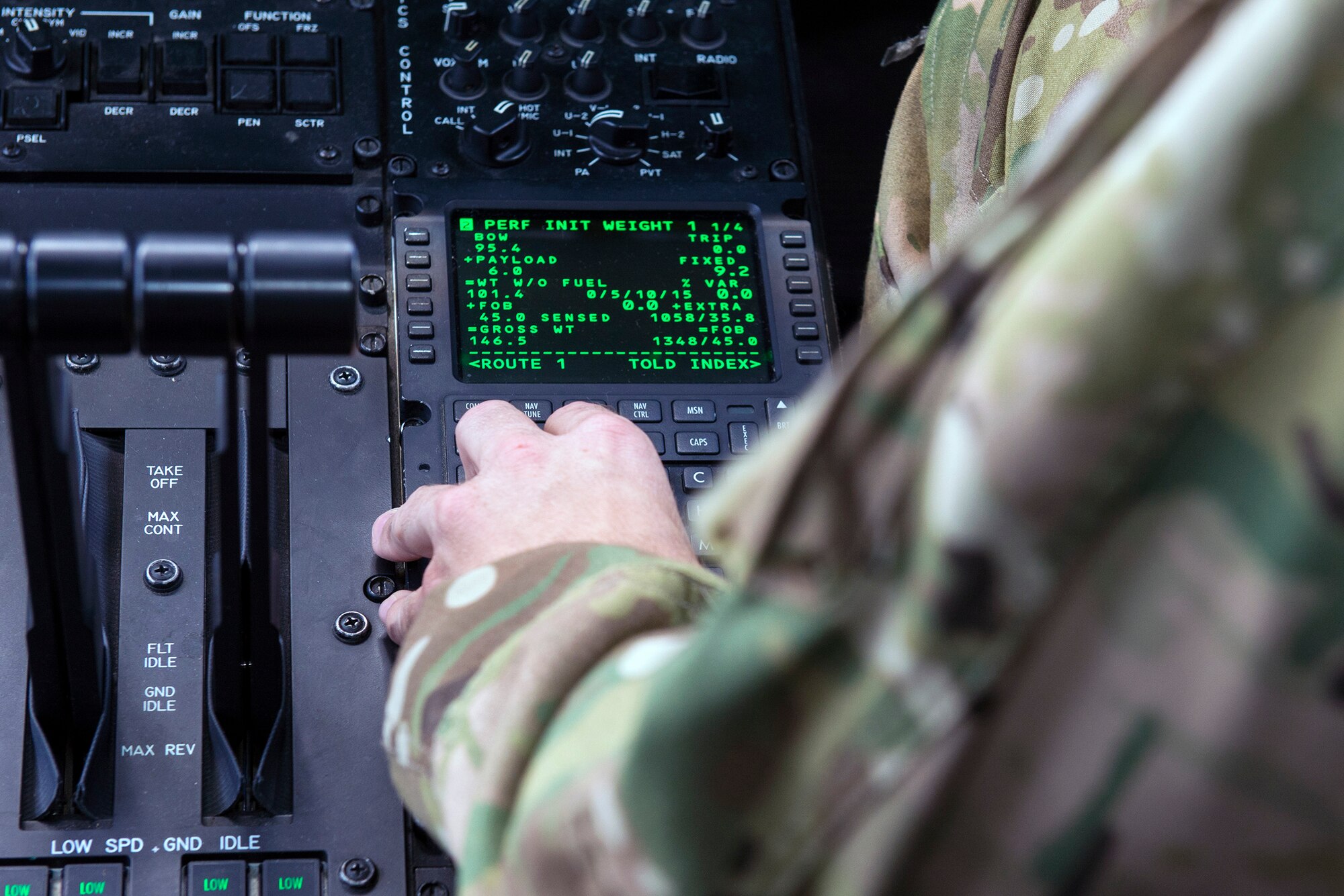 U.S. Air Force 1st Lt. Keegan Peckham, 71st Rescue Squadron HC-130J Combat King II pilot, actuates the control panel of an HC-130J Combat King II to deliver supply assets in support of Exercise Red Flag, Aug. 12, 2016, at Moody Air Force Base, Ga. The exercise is the premier air-combat training event held at Nellis AFB, Nev., and is overseen by the U.S. Air Force Warfare Center. (U.S. Air Force photo by Airman 1st Class Greg Nash)