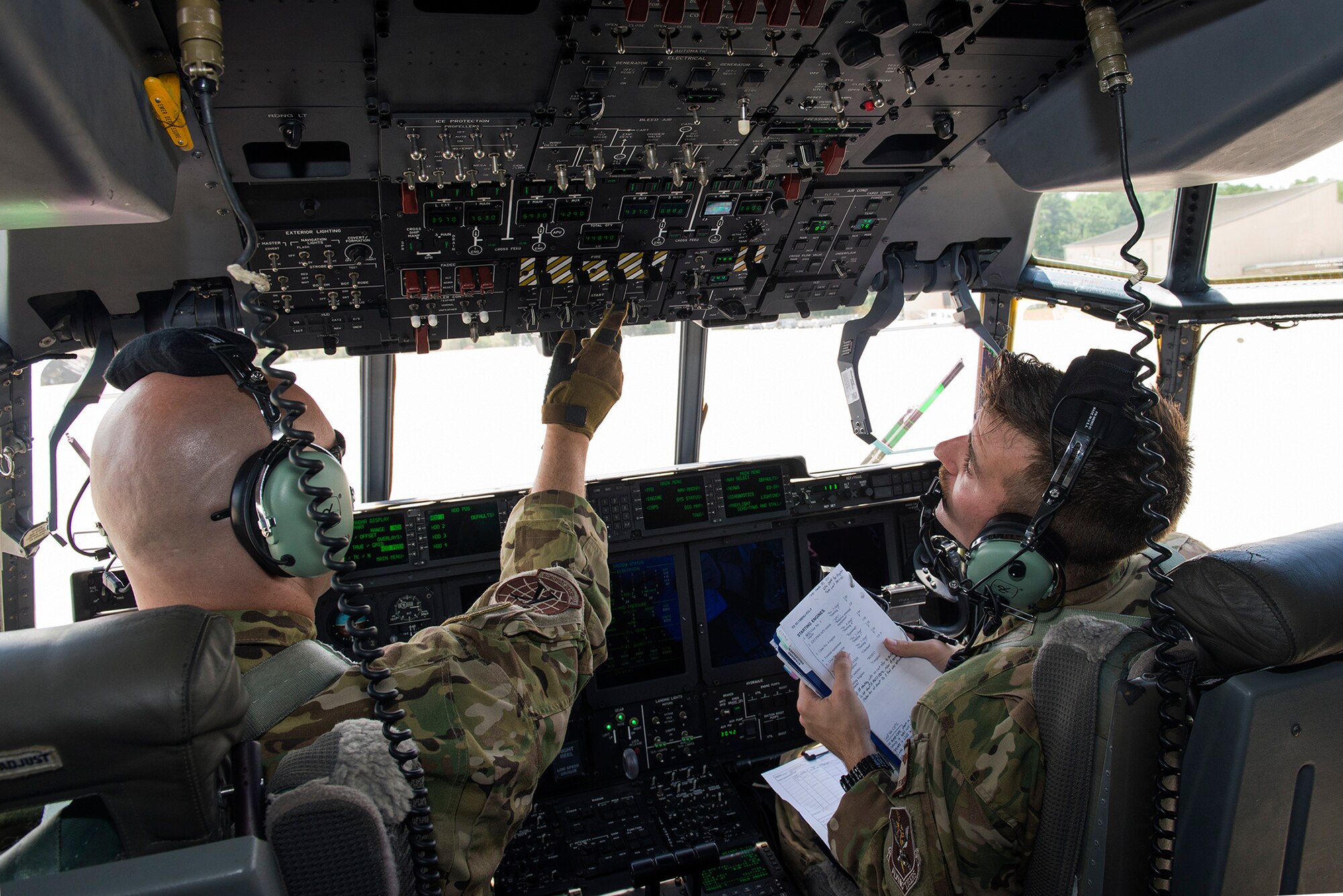 U.S. Air Force 71st Rescue Squadron pilots Capt. Trevor Millette, left, and 1st Lt. Keegan Peckham, prepare to start the engines of an HC-130J Combat King II to launch for Exercise Red Flag, Aug. 12, 2016, at Moody Air Force Base, Ga. Moody’s 347th Operation Support Squadron aircraft flight equipment technicians and 23d Maintenance Group maintainers are providing support during the aerial-combat exercise. (U.S. Air Force photo by Airman 1st Class Greg Nash)