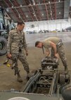 U.S Air Force Staff Sgt. John Dunlap, a 35th Aircraft Maintenance Unit F-16 Fighting Falcon crew chief deployed from Kunsan Air Base, Republic of Korea, intakes equipment from maintenance Airmen Aug. 11, 2016, during RED FLAG-Alaska (RF-A) 16-3 at Eielson Air Force Base, Alaska. Dunlap is in charge of issuing and ensuring the continuity of equipment and materials for 155 Airmen during RF-A, an exercise where units from across the Department of Defense and partner nations train for contingency operations in a controlled environment that stresses joint and multinational integration. (U.S. Air Force photo by Staff Sgt. Shawn Nickel) 