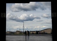 U.S. Air Force Staff Sgt. John Dunlap, a 35th Aircraft Maintenance Unit F-16 Fighting Falcon crew chief deployed from Kunsan Air Base, Republic of Korea, his wife Jennifer and 6-month-old baby Evelyn, watch from the Thunderdome as fighter jets from the U.S. Air Force, Navy and Royal Canadian Air Force take off after his shift Aug. 11, 2016, during RED FLAG-Alaska (RF-A) 16-3 at Eielson Air Force Base, Alaska. After four months not standing on American soil together, RF-A, a Pacific Air Forces commander-directed exercise, gave the family a cost effective opportunity to visit during Dunlap’s off time. (U.S. Air Force photo by Staff Sgt. Shawn Nickel)