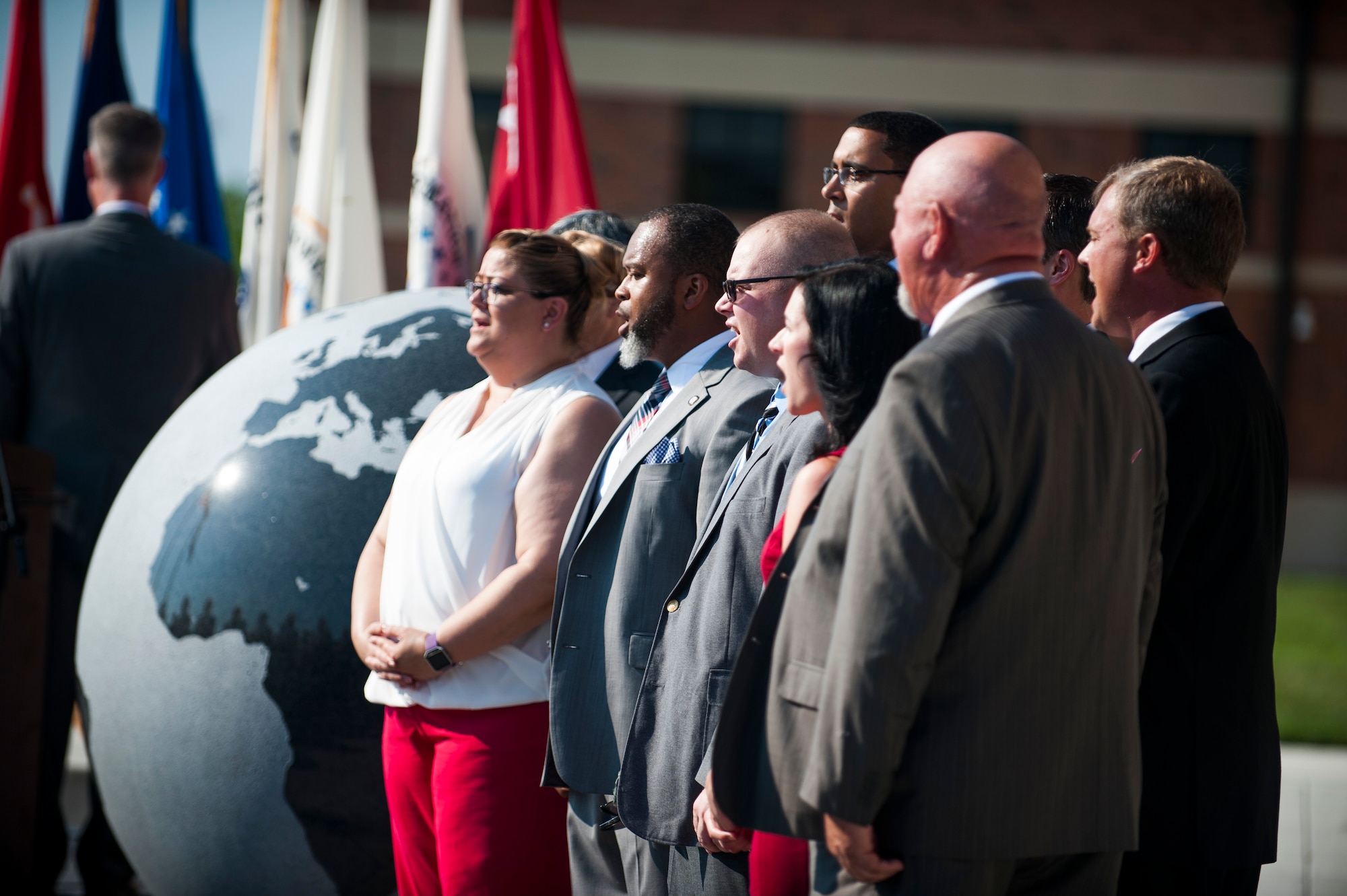 The Defense Information Systems Agency Global Operations Command Choir sings the national anthem during a ribbon cutting ceremony for the new DISA compound at Scott Air Force Base, Ill., Aug. 11, 2016. DISA Global is the nation's premier cyber protection division and executes global mission support and emergency response coordination. (U.S. Air Force photo by Staff Sgt. Clayton Lenhardt/Released)