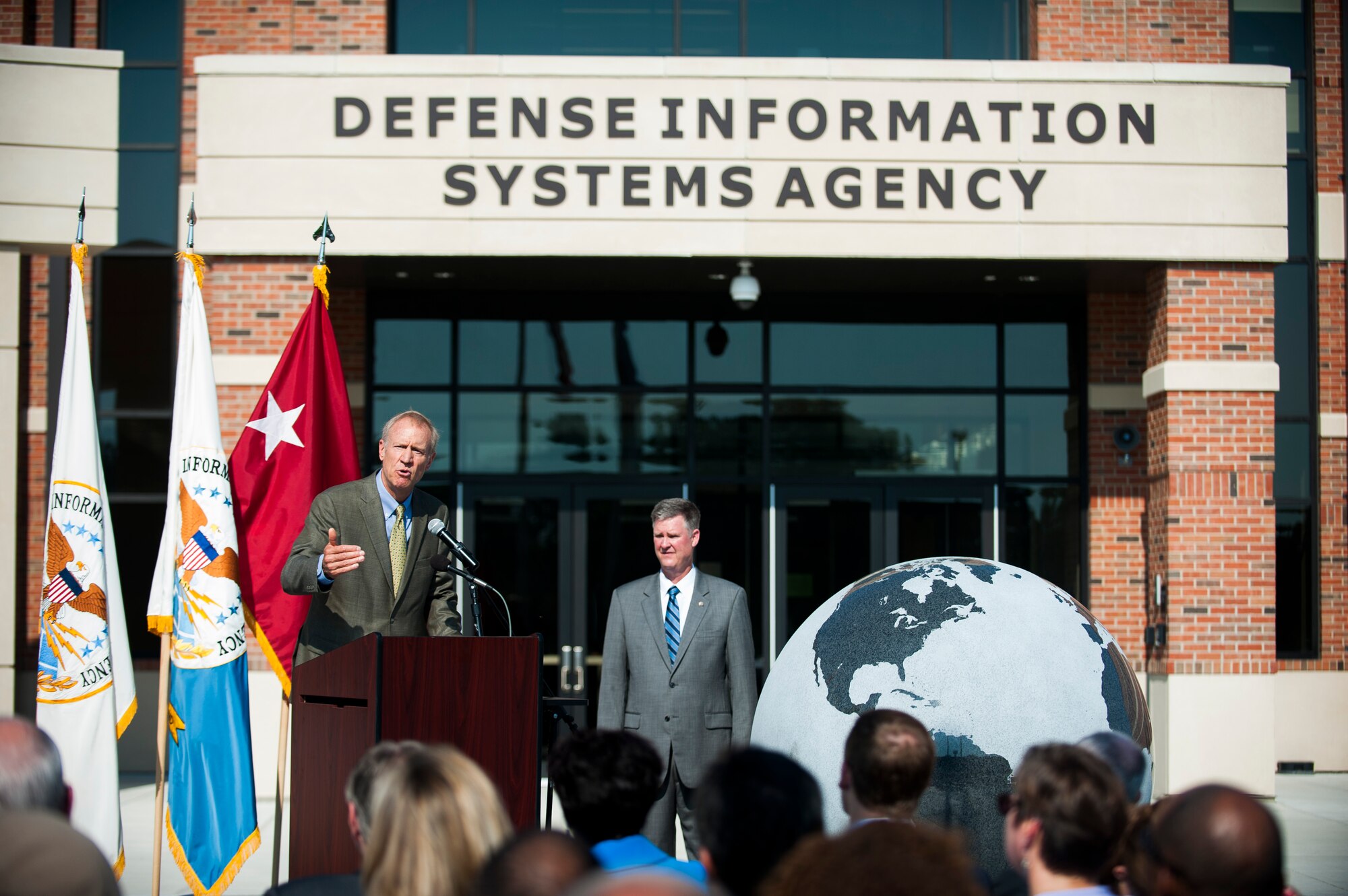 Ill. Gov. Bruce Rauner delivers a speech during a ribbon cutting ceremony for the new Defense Information Systems Agency compound at Scott Air Force Base, Ill., Aug. 11, 2016. Civil leaders from across the state attended the opening of the state of the art compound. (U.S. Air Force photo by Staff Sgt. Clayton Lenhardt/Released)