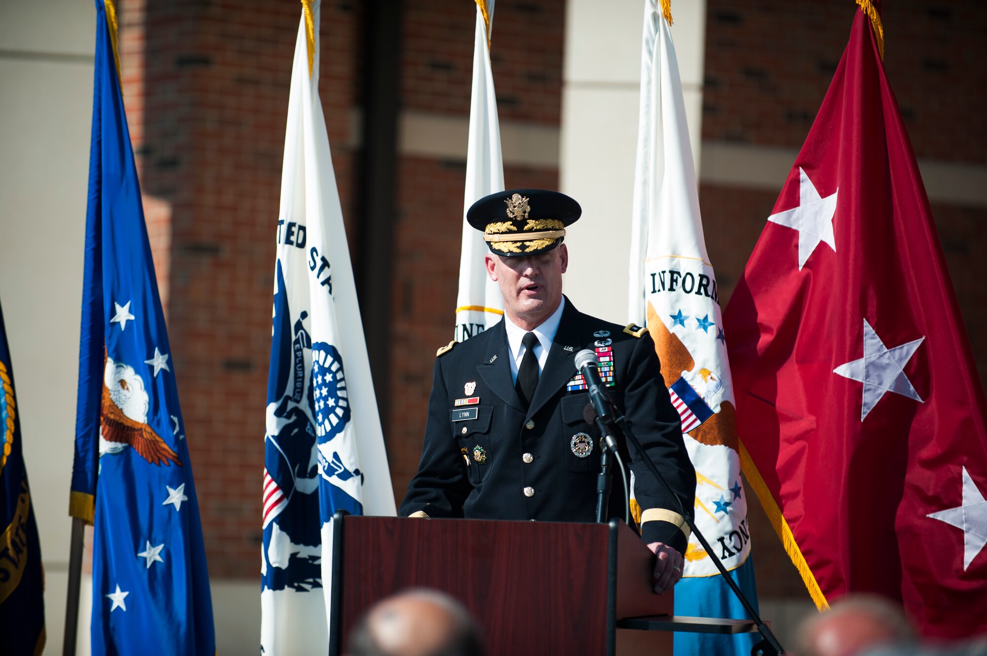U.S. Army Lt. Gen Alan Lynn, Defense Information Systems Agency director, delivers a speech during a ribbon cutting ceremony for the new DISA compound at Scott Air Force Base, Ill., Aug. 11, 2016. The $100 million facility was completed on time and under budget. (U.S. Air Force photo by Staff Sgt. Clayton Lenhardt/Released)