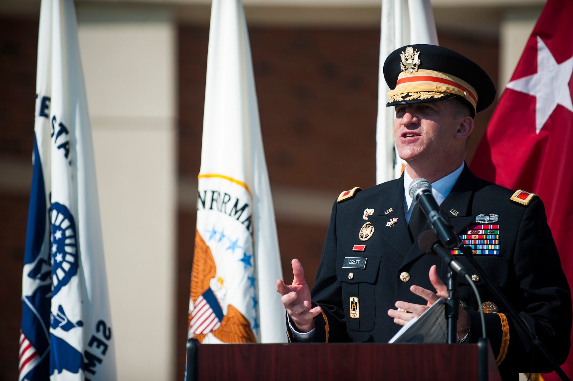 U.S. Army Col. Paul Craft, Defense Information Systems Agency Global Operations Command commander, delivers a speech during a ribbon cutting ceremony for the new DISA compound at Scott Air Force Base, Ill., Aug. 11, 2016. DISA Global is the nation's premier cyber protection division and executes global mission support and emergency response coordination. (U.S. Air Force photo by Staff Sgt. Clayton Lenhardt/Released)