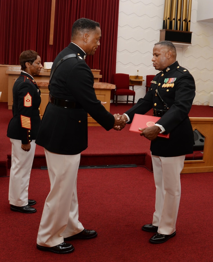 Maj. Gen. Craig Crenshaw (left), commanding general, Marine Corps Logistics Command, serves as the retiring official for Maj. Lee Taylor (right), operations actions officer/mission assurance officer, LOGCOM, in a ceremony at Marine Corps Logistics Base Albany's Chapel of the Good Shepherd, Aug. 12. Taylor, who has devoted 30 years in service to the nation, began his active-duty career in the enlisted ranks, later attended Officer Candidate School and became a Marine commissioned officer in March 2002.