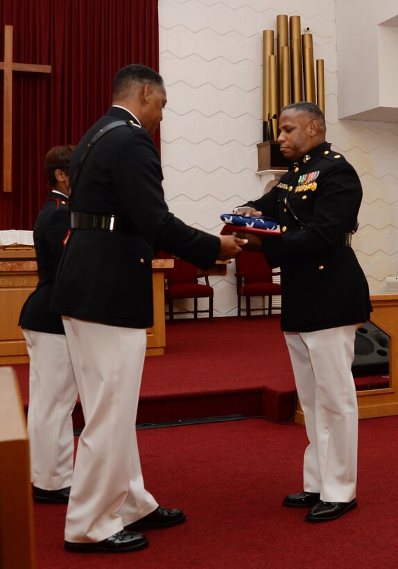 Maj. Gen. Craig Crenshaw (left), commanding general, Marine Corps Logistics Command, serves as the retiring official for Maj. Lee Taylor (right), operations actions officer/mission assurance officer, LOGCOM, in a ceremony at Marine Corps Logistics Base Albany's Chapel of the Good Shepherd, Aug. 12. Taylor, who has devoted 30 years in service to the nation, began his active-duty career in the enlisted ranks, later attended Officer Candidate School and became a Marine commissioned officer in March 2002.