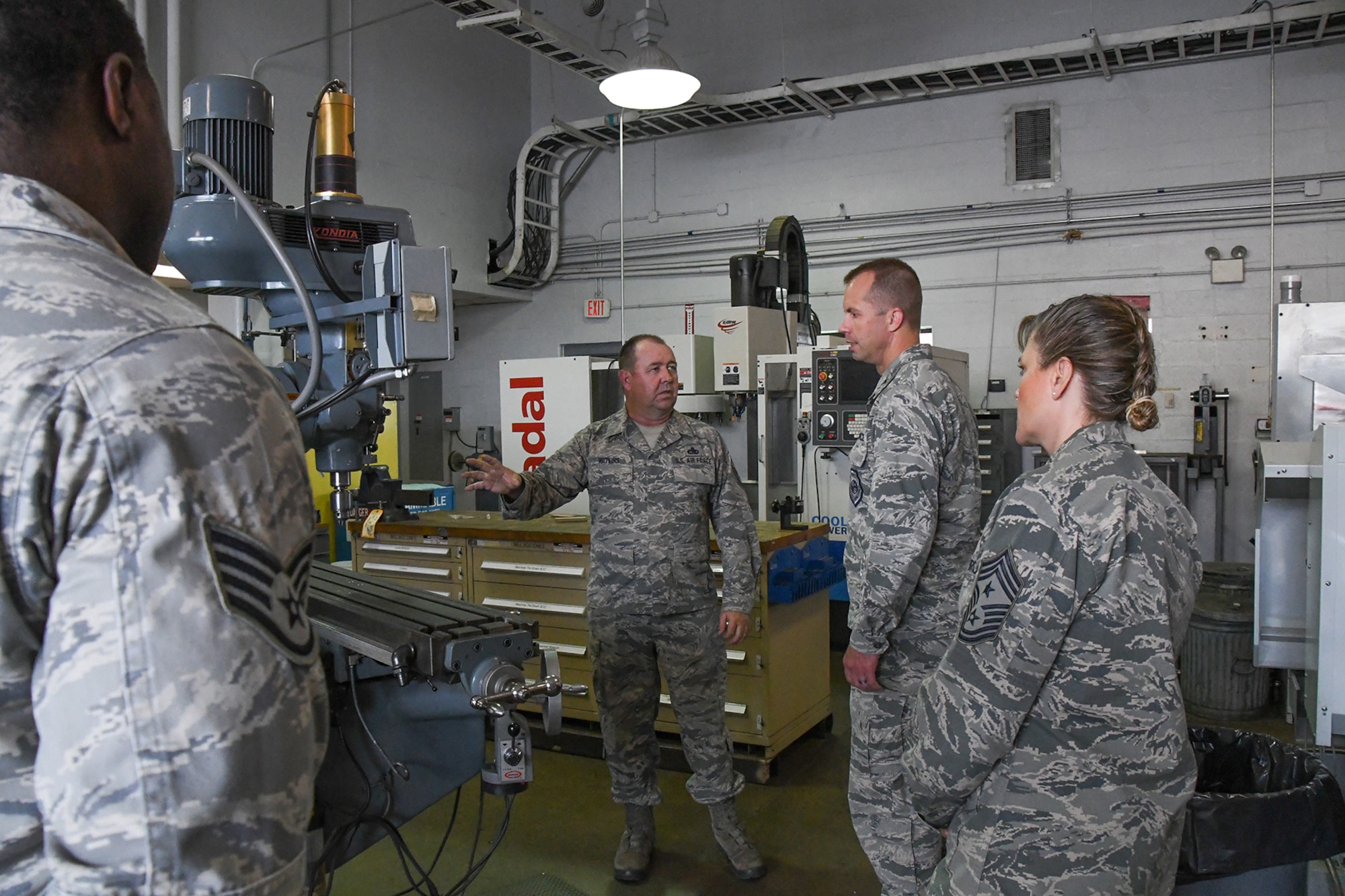 U.S. Air Force Master Sgt. Gene Watkins, a Metals Technology supervisor assigned to the 307th Maintenance Squadron, shows the different equipment available to the Reservists and integrated Active Duty Airmen in the Metals Technology Flight to Col. Ty Neuman, the 2nd Bomb Wing commander, and Chief Master Sgt. Teresa Clapper, the Command Chief for the 2 BW, on August 15, 2016. Neuman is the new base commander for Barksdale Air Force Base in Louisiana and is receiving a tour of the 307th Bomb Wing which is a tenant unit on the base. (U.S. Air Force photo by Master Sgt. Dachelle Melville/Released)