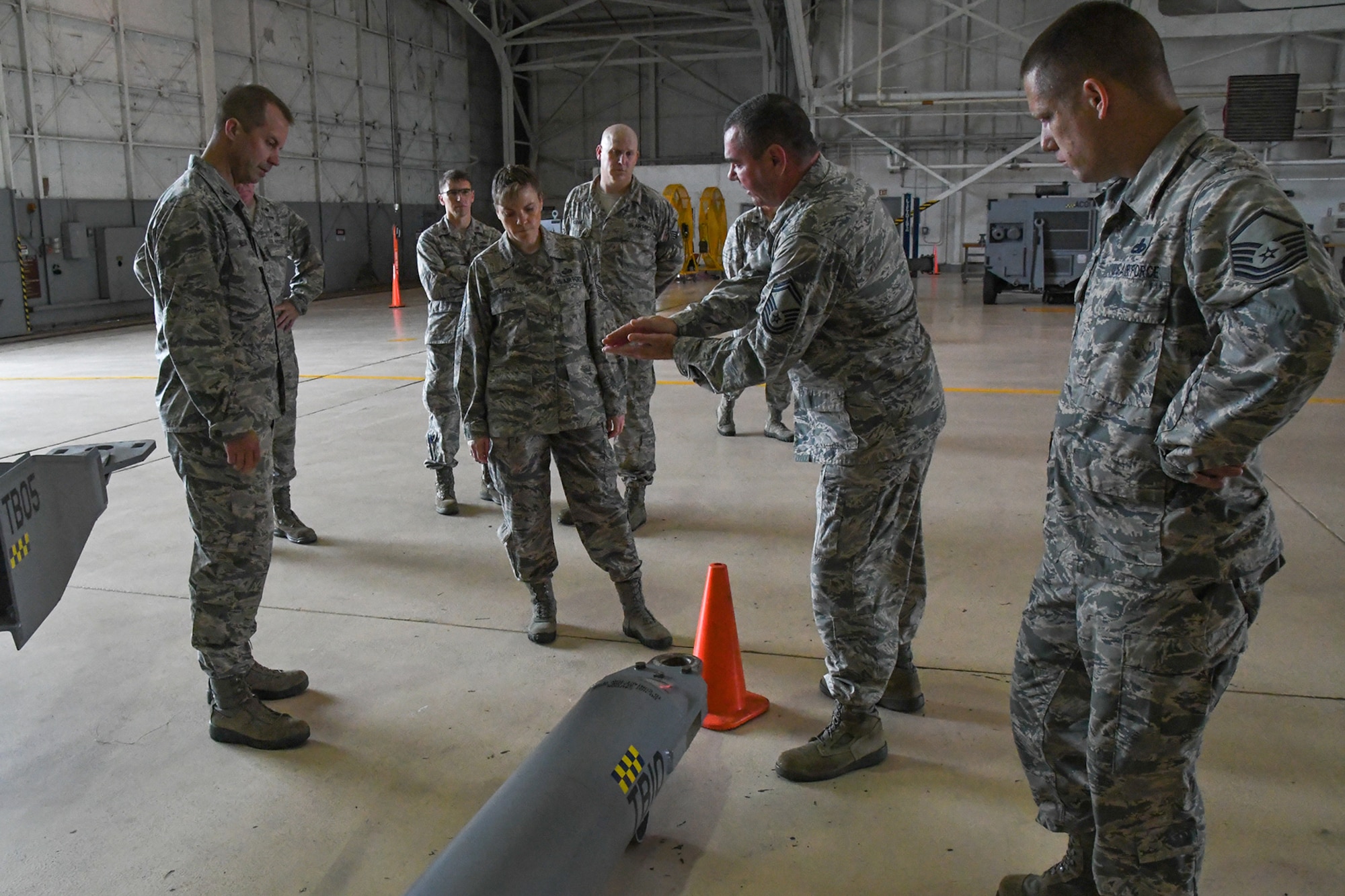 U.S. Air Force Col. Ty Neuman, the 2nd Bomb Wing commander, and Chief Master Sgt. Teresa Clapper, the Command Chief for the 2 BW, listen to Senior Master Sgt. Johnnie Gilbert, the Air and Ground Equipment Flight chief assigned to the 307th Maintenance Squadron, describe a stress point on the tow bars used on the B-52 Stratofortress bombers at Barksdale Air Force Base, La. Neuman is the new base commander on Barksdale and received a tour on August 15, 2016 of the Reserve 307th Bomb Wing which is a tenant unit on the base. (U.S. Air Force photo by Master Sgt. Dachelle Melville/Released)
