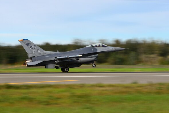 A U.S. Air Force F-16 Fighting Falcon aircraft assigned to the 35th Fighter Squadron assigned to Kunsan Air Base, Republic of Korea, takes off from Eielson Air Force Base, Alaska, for a morning sortie during RED FLAG-Alaska (RF-A) 16-3, Aug. 15, 2016. RF-A enables joint and international units to sharpen their combat skills by flying simulated combat sorties in a realistic threat environment while also allowing them to exchange tactics, techniques and procedures to improve interoperability. (U.S. Air Force photo by Airman 1st Class Cassandra Whitman)