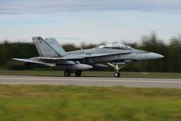 A Royal Canadian Air Force CF-18 Hornet aircraft assigned to the 409th Tactical Fighter Squadron, Canadian Forces Base Cold Lake, Alberta, takes off from the Eielson Air Force Base, Alaska runway during RED FLAG-Alaska 16-3, Aug. 15, 2016. The aircraft will participate in a morning sortie over the Joint Pacific Alaska Range Complex airspace, which spans more than 67,000 square miles and provides a realistic training environment that allows commanders to train for full spectrum engagements, ranging from individual skills to complex, large-scale engagements. (U.S. Air Force photo by Airman 1st Class Cassandra Whitman)