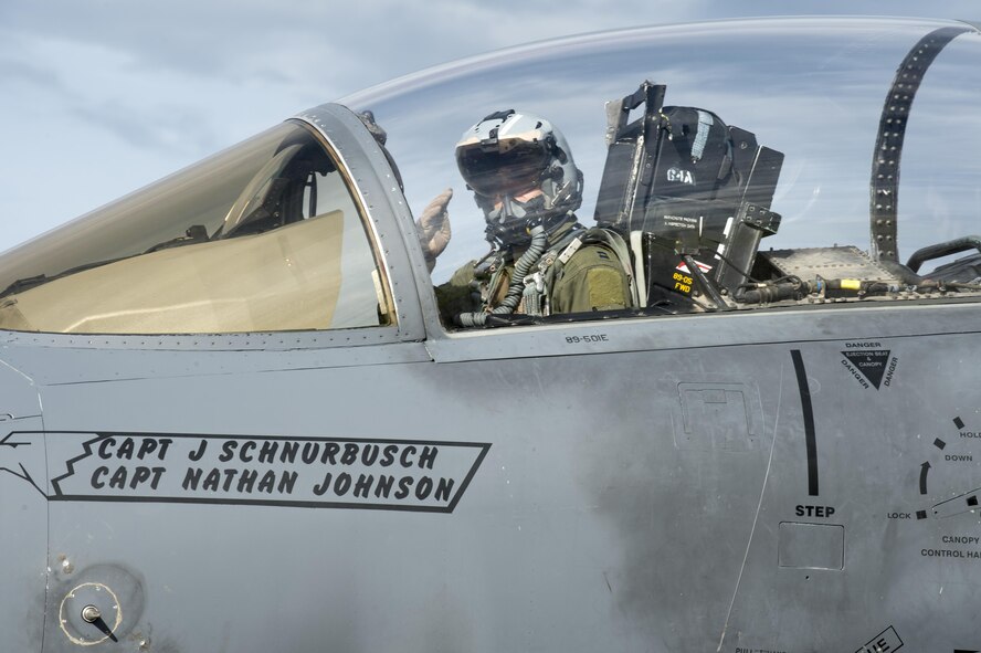 U.S. Air Force Capt. Michael Glatther, an F-15E Strike Eagle pilot assigned to the 336th Fighter Squadron, Seymour Johnson Air Force Base (AFB), N.C., salutes Airman 1st Class Nicholas Proia, an avionics technician assigned to the 4th Aircraft Maintenance Squadron from Seymour Johnson AFB, N.C., from the cockpit, after the equipment on his jet passed inspection in the test cell prior to a sortie at Eielson Air Force Base, Alaska, Aug. 15, 2016, during RED FLAG-Alaska (RF-A) 16-3. Free exchange of ideas between multilateral forces during RF-A enhances not just partners and sister-service relationships, but also their operational efficiency. (U.S. Air Force photo by Staff Sgt. Shawn Nickel)