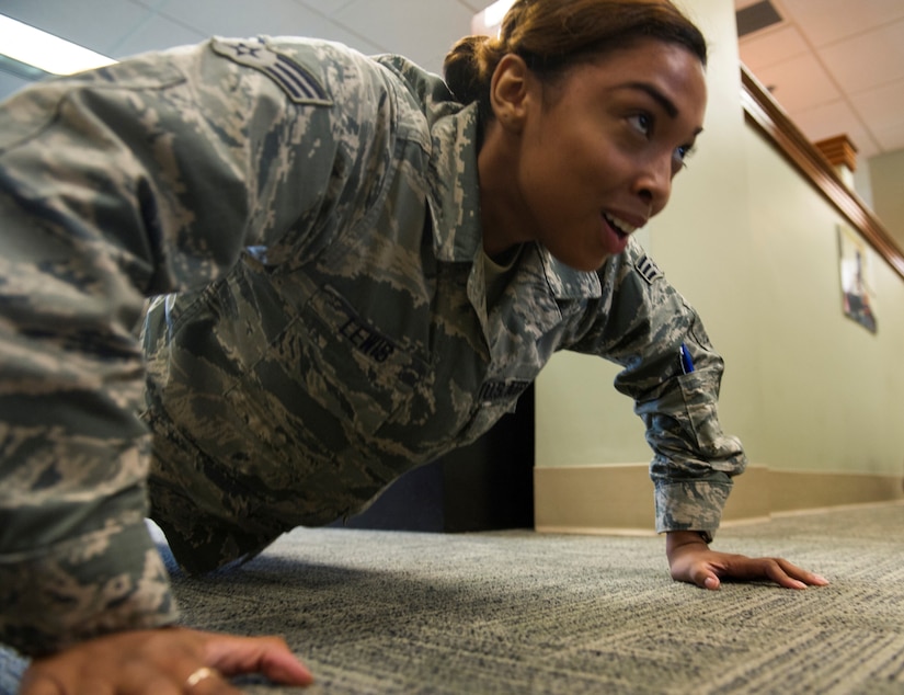 Senior Airman Leesel Lewis, 628th Comptroller Squadron financial management technician, pushes herself as she works out with the rest of her squadron at Joint Base Charleston – Air Base, S.C., Aug. 9, 2016. Just like push-ups in the office, the 628th CPTS challenge themselves and have friendly competitions to improve their health and fitness. (U.S. Air Force photo by Airman 1st Class Thomas T. Charlton)