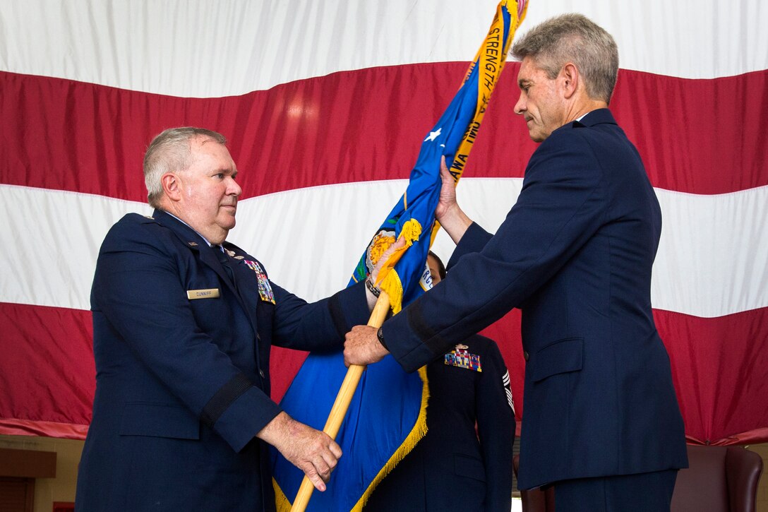 Brig. Gen. Michael L. Cunniff, left, The Adjutant General of New Jersey, presents Brig. Gen. Kevin J. Keehn, Deputy Commander, New Jersey Air National Guard, the NJANG guidon during a Change of Command Ceremony at the 108th Wing, Joint Base McGuire-Dix-Lakehurst, N.J., Aug. 13, 2016. Keehn replaced Brig. Gen. Robert C. Bolton as the commander of the New Jersey Air National Guard. A change of command ceremony is a military tradition that represents the formal transfer of authority and responsibility for a unit from one officer to another. The New Jersey Air National Guard has two wings – the 108th at Joint Base McGuire-Dix-Lakehurst and the 177th Fighter Wing at Atlantic City Air National Guard Base. (U.S. Air National Guard photo by Master Sgt. Mark C. Olsen/Released)