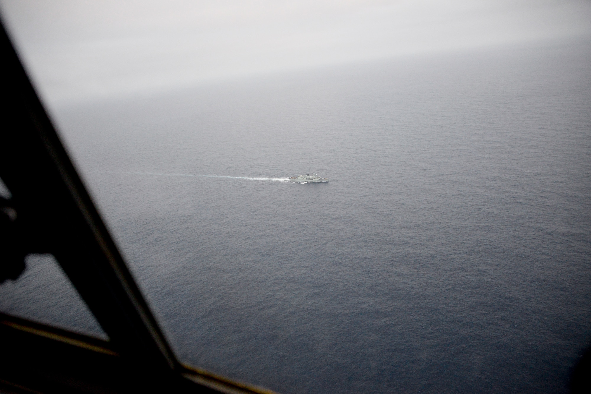 California Air National Guardsmen from the 129th Rescue Wing conducts an overwater rescue mission on the Pacific Ocean in response to a seriously ill 37-year-old crewman on board the HMCS Calgary, a Canadian naval frigate, 800 miles off shore from San Francisco. (U.S. Air National Guard photo by Master Sgt. Ray Aquino/released)