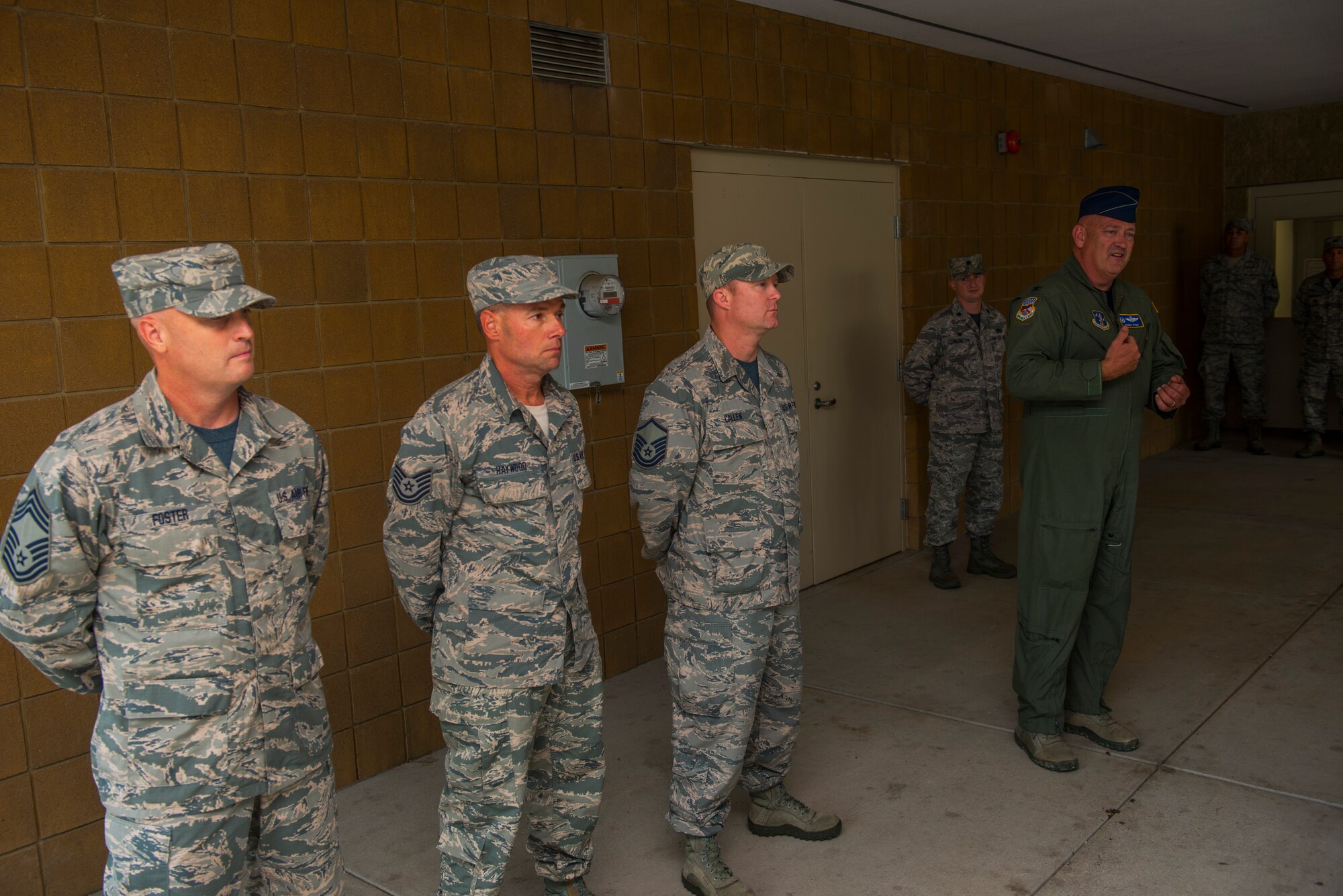 Col. Johnny Ryan, 130th Airlift Wing Commander, recognizes Chief Master Sgt. Steven Foster (left), Tech Sgt. Mark Haywood, and Master Sgt. Jeremy Callen all from the 130th Civil Engineering Squadron, for saving the life of Master Sgt. Bruce Chatterton (not pictured) who collapsed shortly after his physical fitness test on Aug. 6, 2016.(United States Air National Guard photo/Tech. Sgt. De-Juan Haley)