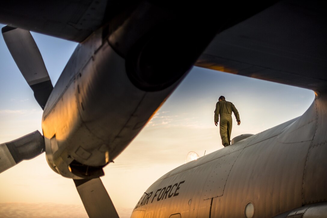 Air Force Staff Sgt. Johnathan Santiago walks on a C-130 Hercules as he inspects the aircraft before an airdrop mission during Northern Strike 2016, an exercise the National Guard Bureau sponsors, at Alpena Combat Readiness Training Center in Alpena, Mich., Aug. 11, 2016. Santiago and the aircraft are assigned to  the 165th Airlift Wing. The exercise unites about 5,000 Army, Air Force, Marine, and Special Forces service members from 20 states and three coalition countries for three weeks of training and maneuvers. Air National Guard photo by Master Sgt. Scott Thompson