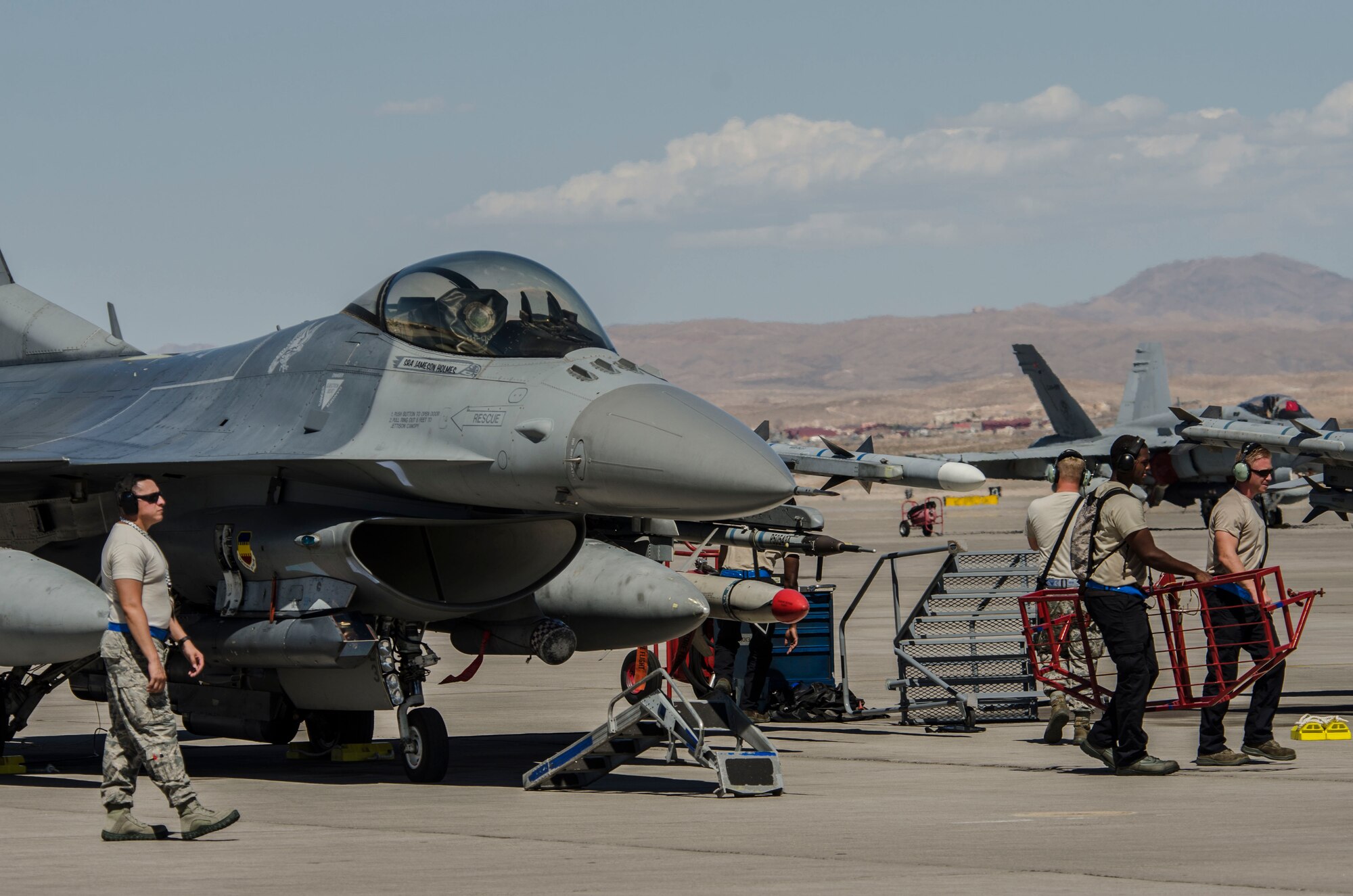 U.S. Air Force maintainers from the 20th Fighter Wing at Shaw Air Force Base, S.C., ready an F‐16CM Fighting Falcon at Nellis Air Force Base, Nev., Aug. 13, 2016. The F‐16 played an intricate part of Red Flag 16‐4 the world’s premiere combat training exercise. (U. S. Air Force photo by Tech. Sgt. Frank Miller/Released)
