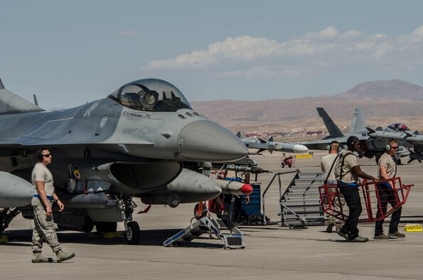 U.S. Air Force maintainers from the 20th Fighter Wing, Shaw Air Force Base, S.C., ready an F‐16CM Fighting Falcon at Nellis Air Force Base, Nev., Aug. 13, 2016. The F‐16 Fighting Falcon played an intricate part of Red Flag 16‐4 the world’s premiere combat training exercise. (U. S. Air Force photo by Tech. Sgt. Frank Miller/Released)