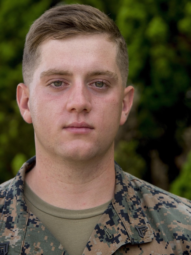 Cpl. Jordan Aaron Summerton stands in front of his barracks, on Camp Schwab, Okinawa, Japan, Aug. 10, 2016. He just finished packing up and is ready to return home from a six-month deployment in the Pacific. Summerton, a Colombia, South Carolina, native, is a mortarman with Headquarters and Service Company, 2nd Battalion, 2nd Marine Regiment, which supported III Marine Expeditionary Force under the unit deployment program. (U.S. Marine Corps photo by Lance Cpl. Amaia Unanue/ Released)