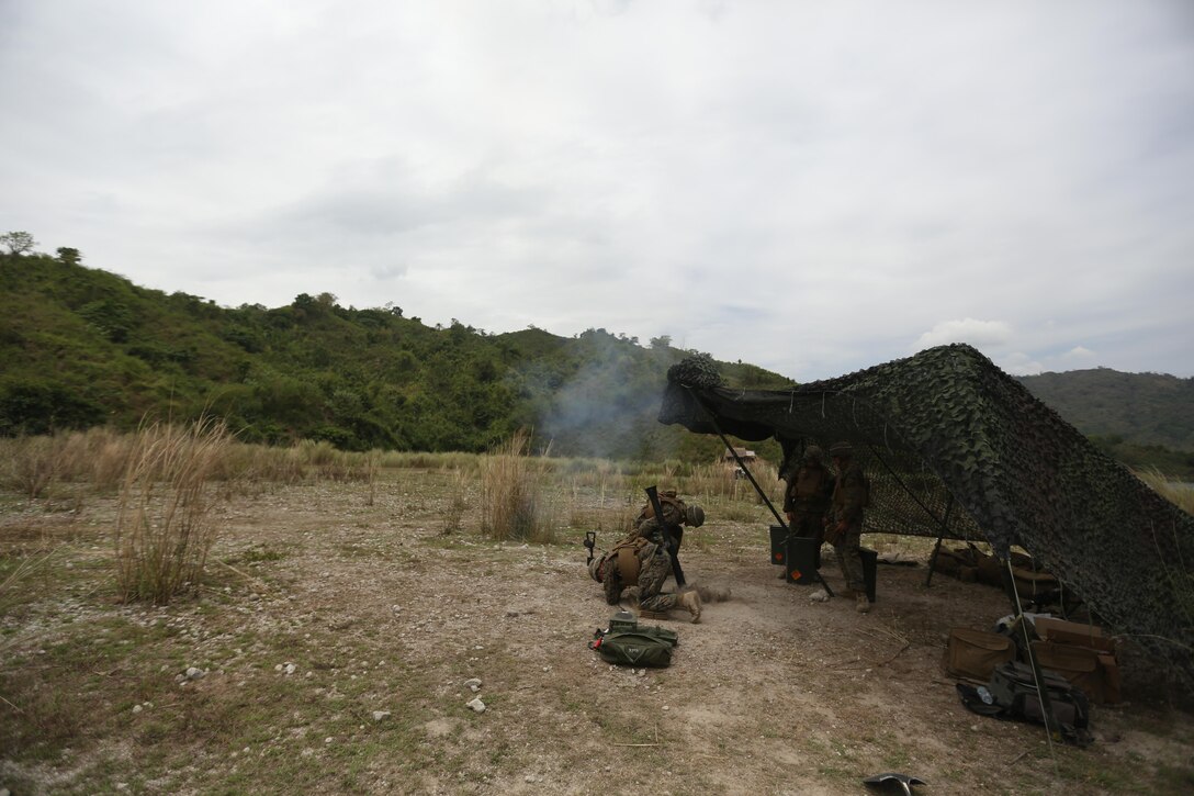 U.S. Marines Lance Cpl. Michael D. Reaume, assistant gunner, and Lance Cpl. Jordan A. Summerton, gunner, 2nd battalion 2nd Marines, 81st platoon, with 2nd Marine Division fires the 81 mm Mortar System at Crow Valley, Philippines, on April 5, 2016. U.S. and Philippine Marines integrated together to fire 81 mm Mortar Systems. Balikatan is an annual Philippines-U.S. military bilateral training exercise that is a signature element of the Philippine-U.S. alliance focused on a variety of missions to include humanitarian assistance maritime law enforcement, and environment protection. (U.S. Marine Corps photo by Lance Cpl. Cameron Darrough/Released)