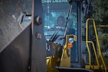 Chief Master Sgt. Jennifer Brembah, 52nd Mission Support Group superintendent, practices operating a front-end loader during an “out and about” visit at Spangdahlem Air Base, Germany, Aug. 11, 2016. 52nd Fighter Wing leadership spent the morning with the 52 Civil Engineering Squadron heavy equipment operators, or "Dirt Boyz," to learn about their daily mission. (U.S. Air Force photo by Tech. Sgt. Christopher Parr)