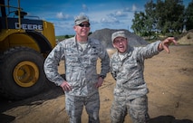 Col. Joe McFall, 52nd Fighter Wing commander, receives instruction from Airman 1st Class Tyler Carrigan, 52nd Civil Engineer Squadron, on how to operate a grader as part of an "out and about" visit with 52nd CES at Spangdahlem Air Base, Germany, Aug. 11, 2016.  (U.S. Air Force photo by Tech. Sgt. Christopher Parr)
