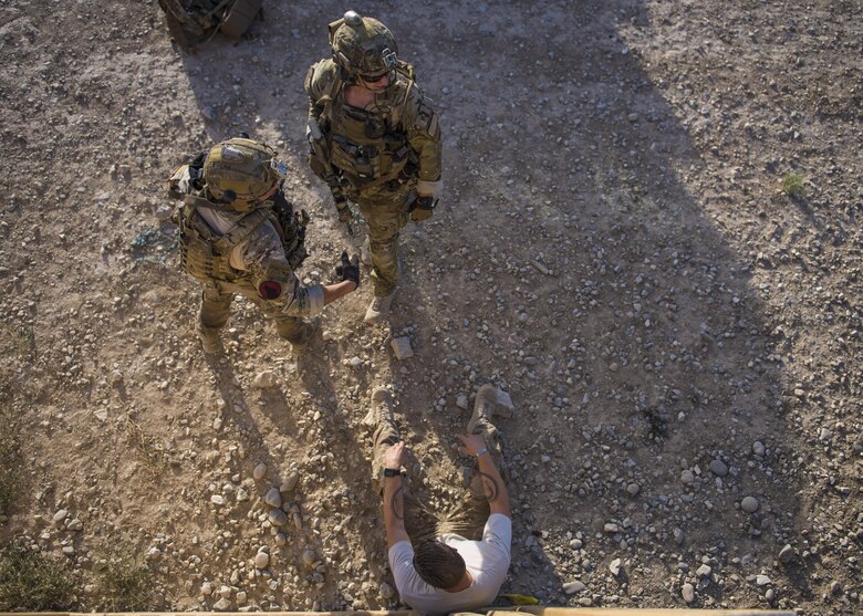 Pararescue specialists from the 83rd Expeditionary Rescue Squadron, rush to assist simulated wounded patients during a mass casualty exercise, Bagram Airfield, Afghanistan, Aug. 16, 2016. The 83rd ERQS participates in a real world scenario exercises in order to maintain readiness standards and demonstrate theater personnel recovery capabilities. (U.S. Air Force photo by Senior Airman Justyn M. Freeman)