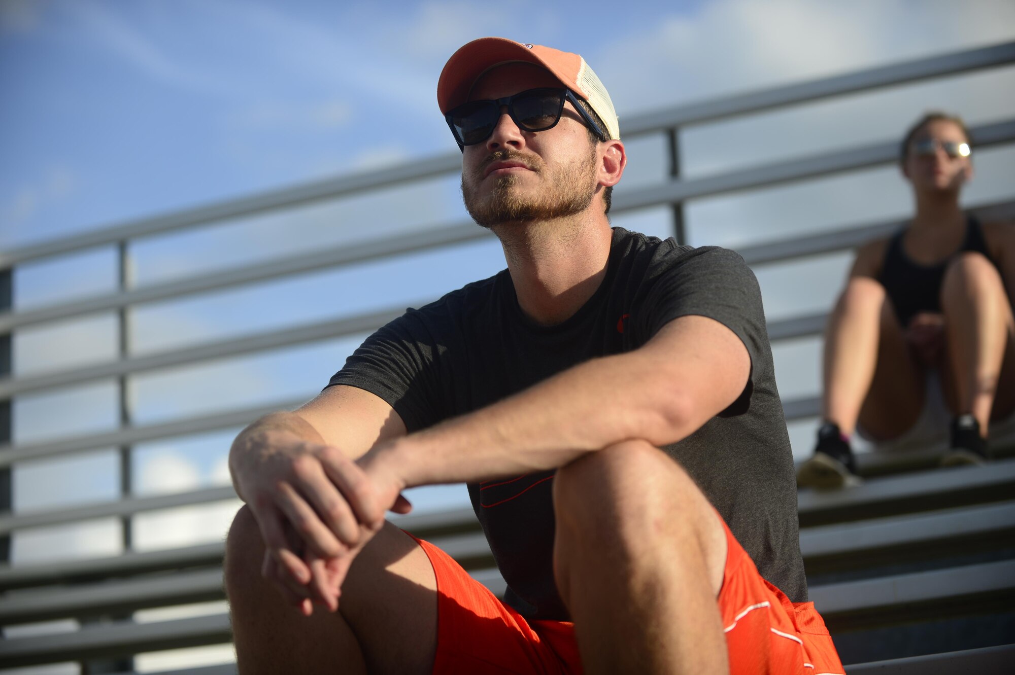 A spectator watches the 2016 Intramural Softball Championship game at Langley Air Force Base, Va., Aug. 10, 2016. About 50 players and spectators gathered to watch the teams battle to earn the first place trophy. (U.S. Air Force photo by Airman 1st Class Kaylee Dubois)
