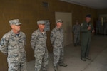 Col. Johnny Ryan, 130th Airlift Wing Commander, recognizes Chief Master Sgt. Steven Foster (left), Tech Sgt. Mark Haywood, and Master Sgt. Jeremy Callen all from the 130th Civil Engineering Squadron, for saving the life of Master Sgt. Bruce Chatterton (not pictured) who collapsed shortly after his physical fitness test on Aug. 6, 2016.