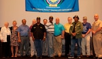 Naval Surface Warfare Center Dahlgren Division (NSWCDD) Commanding Officer CAPT Brian Durant pauses with ten Vietnam War Veterans after personally honoring them with commemorative pins and certificates during a ceremony at the command's Vietnam Commemoration held at the University of Mary Washington, Aug. 11. The event's keynote speaker, Brig. Gen. Wilma Vaught, USAF retired, (left) recounted the women in service - as well as her own service - during the Vietnam era and the challenges they faced. She was the first woman to deploy with an Air Force bomber unit, the first Air Force woman graduate of the Industrial College of the Armed Forces, and one of the most-decorated military women in U.S. history.   