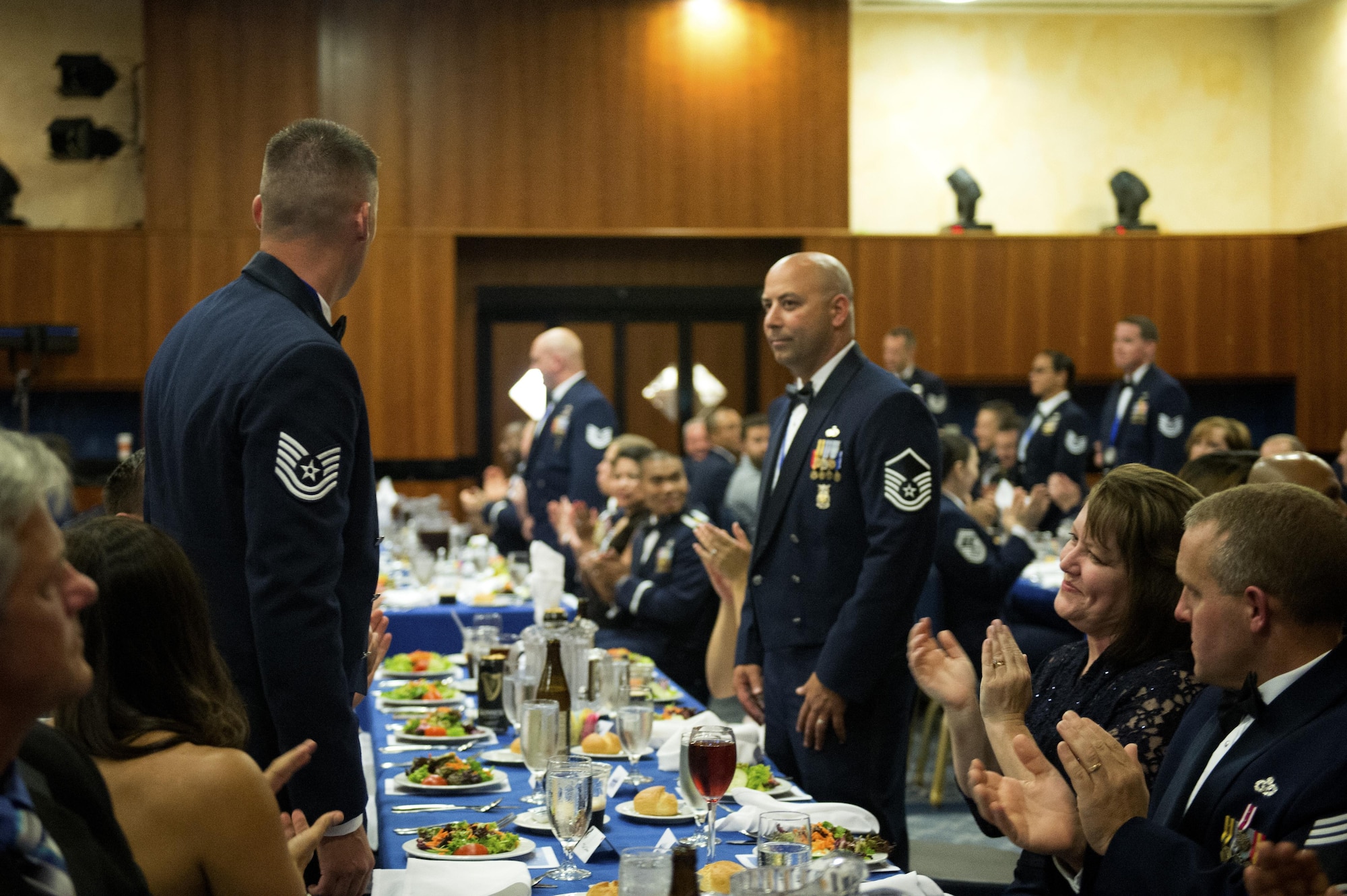 New U.S Air Force master sergeants and master sergeant-selects stand in recognition during a senior NCO induction ceremony at Club Eifel on Spangdahlem Air Base, Germany, Aug. 12, 2016. More than four dozen members received congratulations for their accomplishment of joining the top tier enlisted force. (U.S. Air Force photo by Airman 1st Class Preston Cherry/Released)