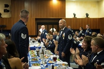 New U.S Air Force master sergeants and master sergeant-selects stand in recognition during a senior NCO induction ceremony at Club Eifel on Spangdahlem Air Base, Germany, Aug. 12, 2016. More than four dozen members received congratulations for their accomplishment of joining the top tier enlisted force. (U.S. Air Force photo by Airman 1st Class Preston Cherry/Released)
