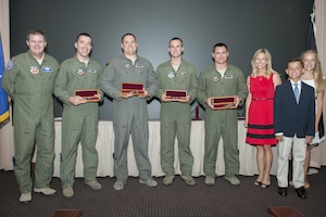 The 2011, 2012, 2014 and 2015 Lt. Col. Anthony C. Shine Fighter Pilot Award winners received engraved knives from Shine’s family during a ceremony at Langley Air Force Base, Va., Aug. 11, 2016. U.S. Air Force Maj. Gen. Thomas Deale, Air Combat Command Headquarters director of operations, presented the winners the awards with the Shine family. (U.S. Air Force photo by Staff Sgt. R. Alex Durbin)